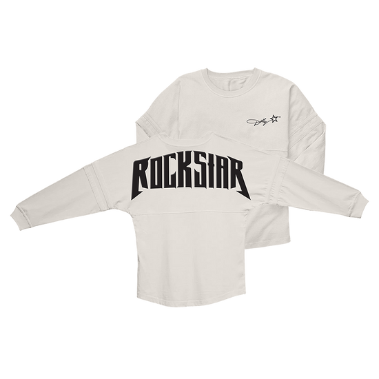 Official Dolly Parton Merchandise. 100% cotton, white unisex game day jersey style long sleeve t-shirt with a wider fit and a round bottom waist. Features the Dolly Rockstar era star logo printed on the front left chest and a black puff print Rockstar album logo printed across the back.