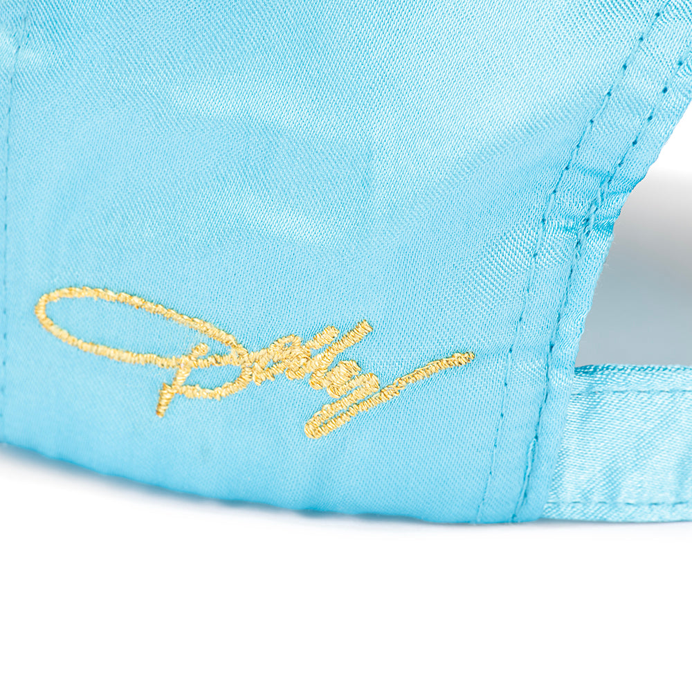 Interior view of the Dolly Parton satin cap showing the clean stitching and satin lining