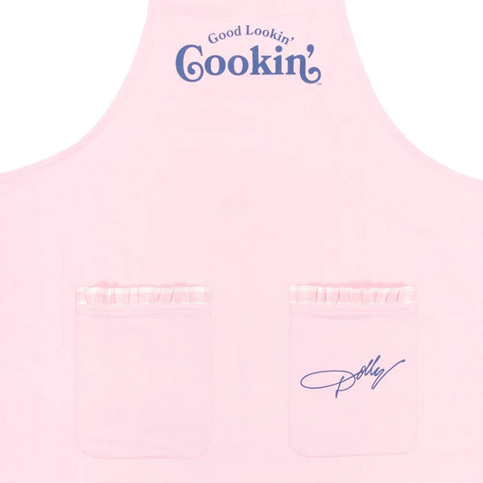 Close-up view of the pink fabric and white Good Lookin' Cookin' text on the apron