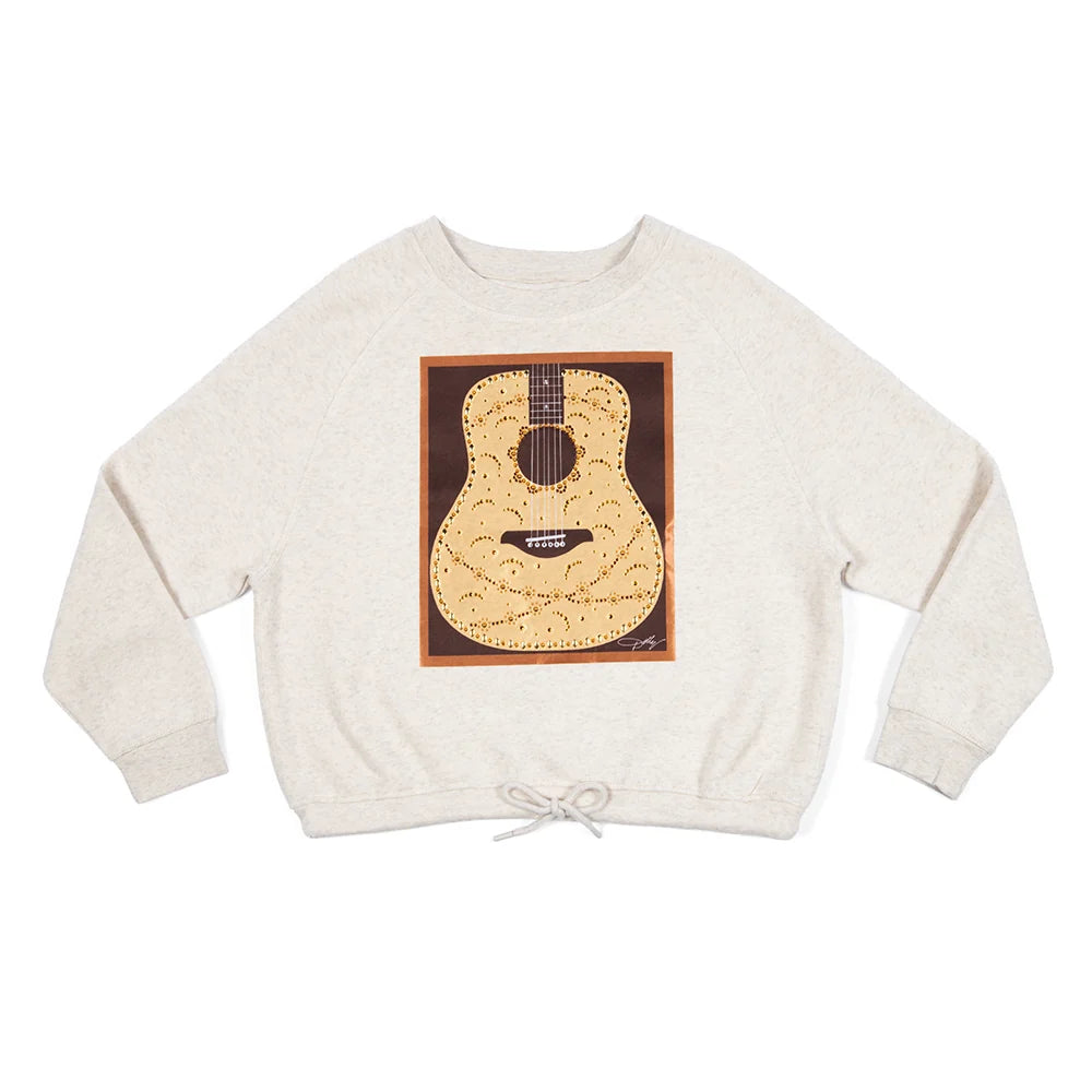Front view of the natural Dolly Parton pullover sweatshirt featuring a rhinestone guitar graphic with satin jeweled details across the chest