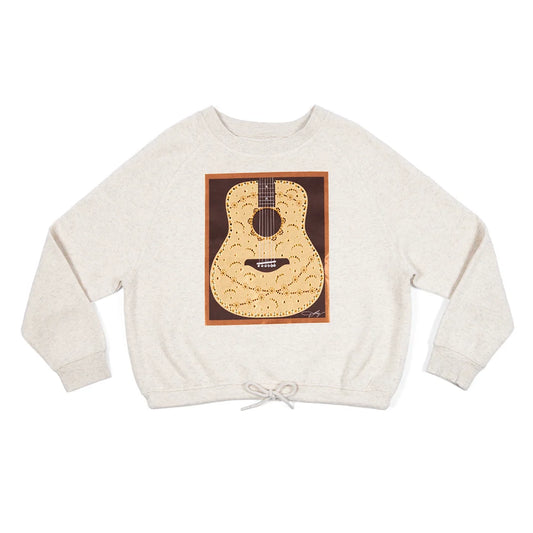 Front view of the natural Dolly Parton pullover sweatshirt featuring a rhinestone guitar graphic with satin jeweled details across the chest