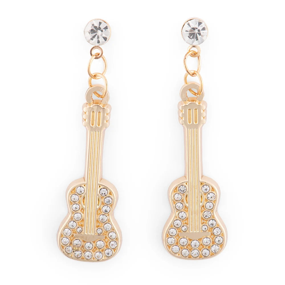 Close-up view of the Dolly Parton guitar earrings highlighting the intricate metalwork and brilliant rhinestone placement