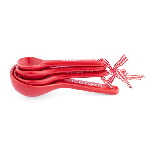 Dolly Parton measuring spoon set featuring Good Lookin Cookin text on a sleek finish