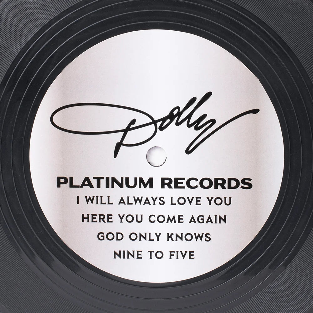 Lifestyle view of the Dolly Parton bag resting on a surface alongside a vinyl record