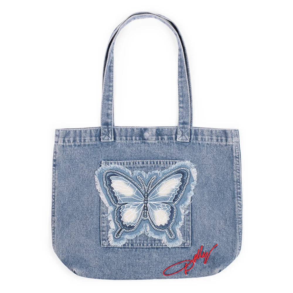 Front view of the Dolly Parton denim butterfly handbag featuring structured blue denim and a decorative butterfly accent