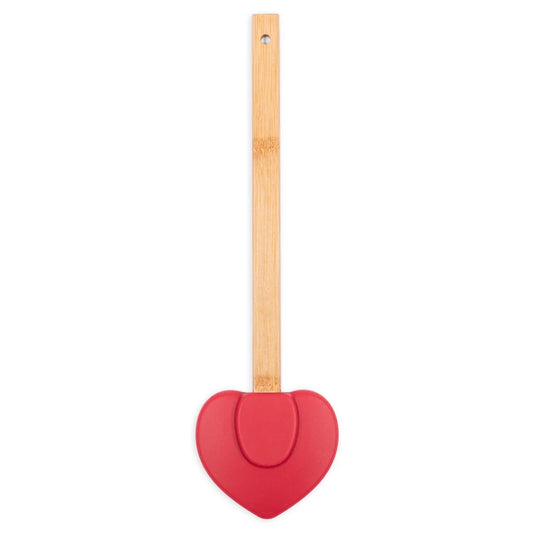 Close-up view of the spatula handle and heart graphic design against a clean kitchen background