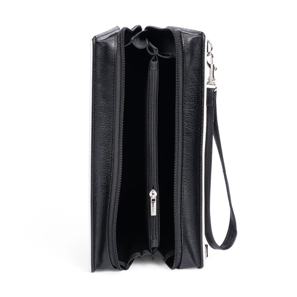 Back view of the Dolly Parton crossbody bag showing the solid color panel and adjustable strap attachment