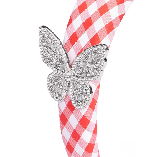 Close-up view of the butterfly and gingham pattern on the Dolly Parton headband
