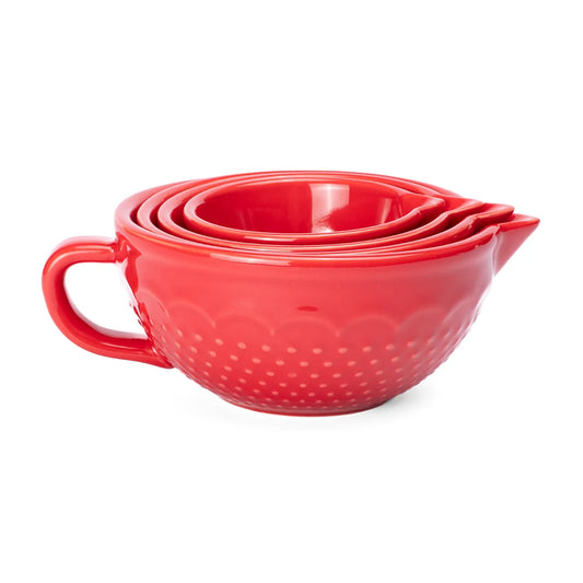 Front view of the Dolly Parton Good Lookin' Cookin' measuring cup set arranged together on a flat surface
