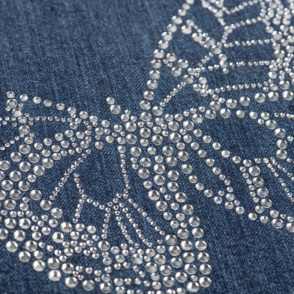 Close-up detail of the rhinestone butterfly embellishment on the front of the denim tote bag