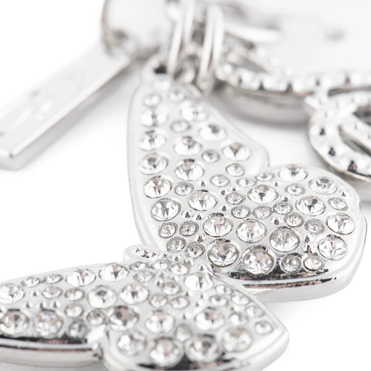 Close-up view of the polished silver butterfly charm featuring intricate wing details