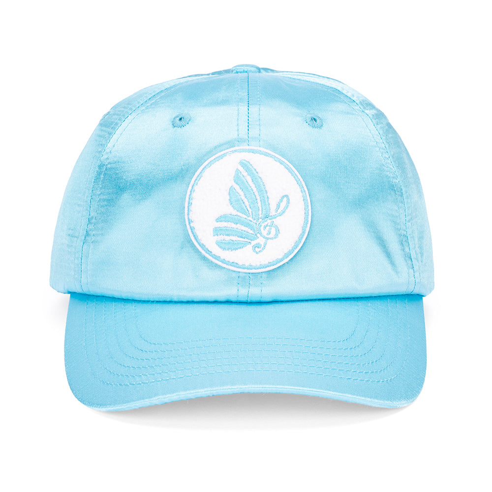 Close-up angle of the blue satin fabric texture on the Dolly Parton cap