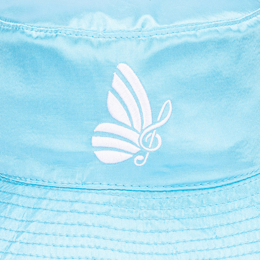 Side view of the blue satin bucket hat showing the soft brim and unstructured silhouette