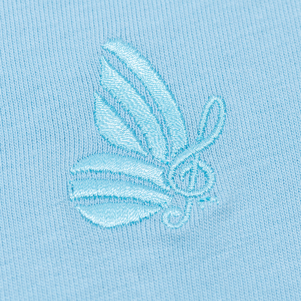 Close-up view of the v-neckline and soft cotton fabric texture of the blue t-shirt