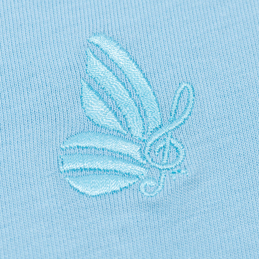 Close-up view of the v-neckline and soft cotton fabric texture of the blue t-shirt