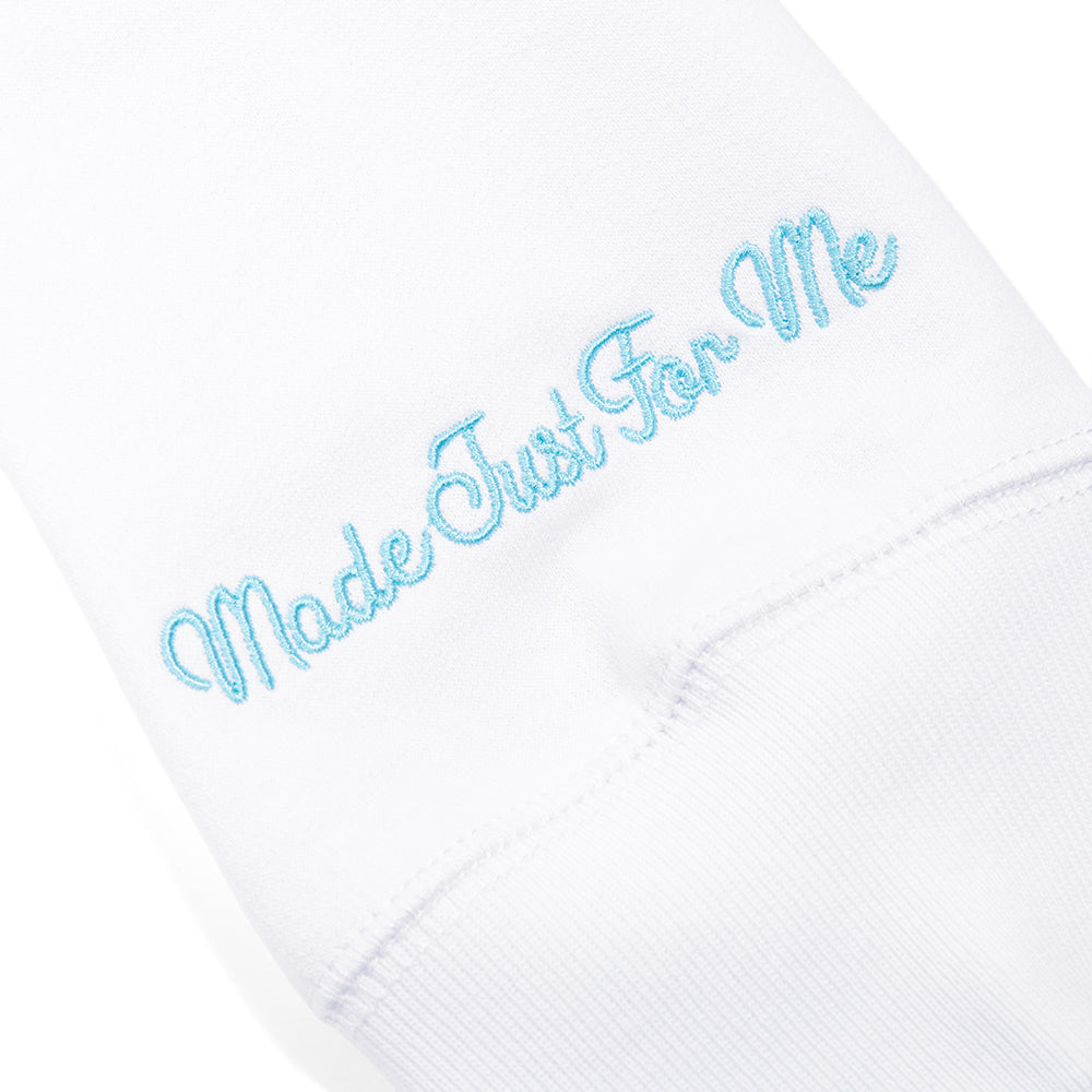Back view of the solid white zip-front hoodie with clean tailoring