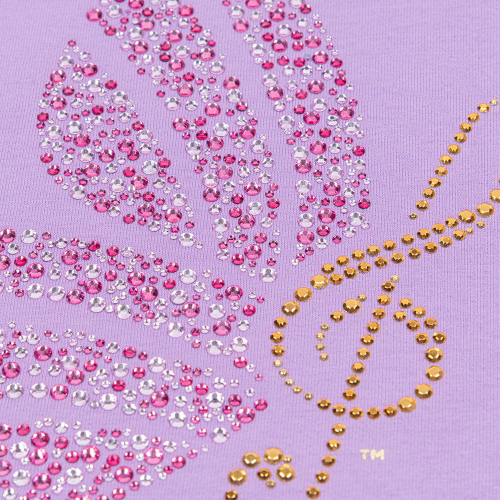 Close-up of the rhinestone embellishment and scoop neckline on the purple cotton t-shirt