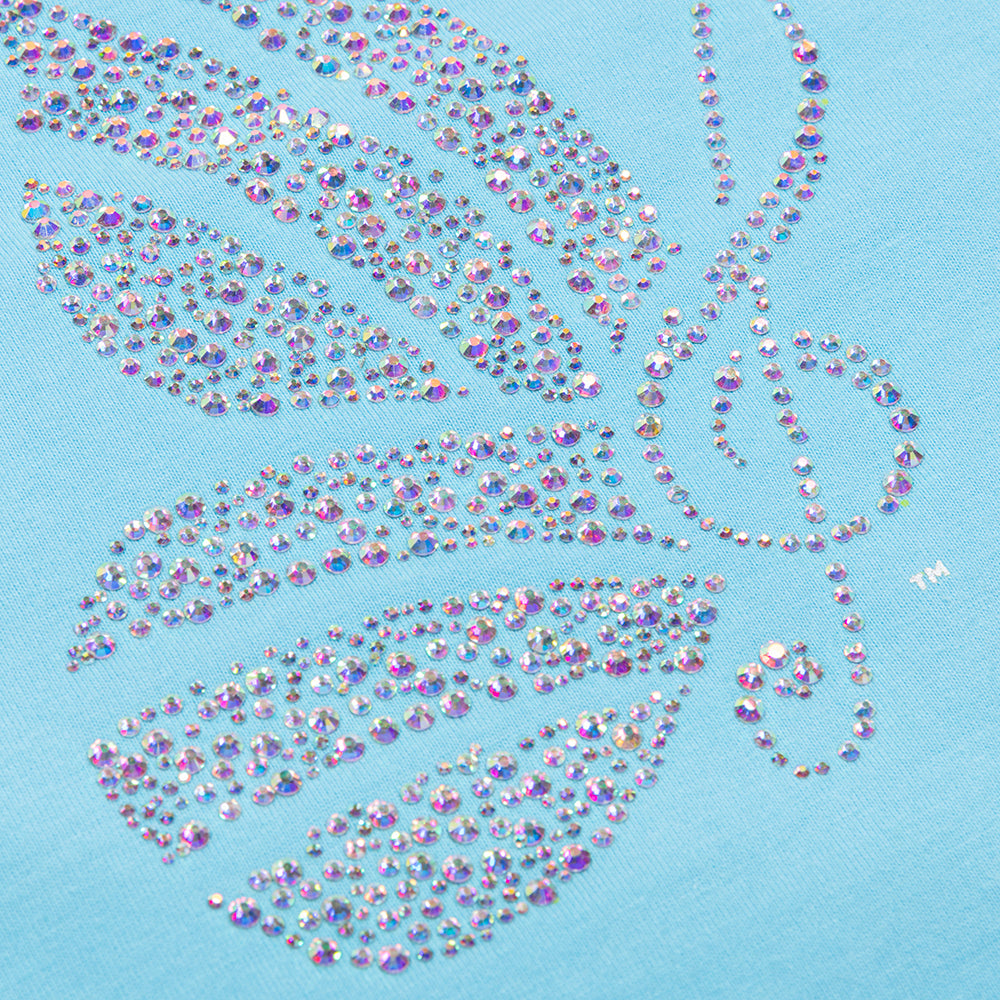 Close-up view of the sparkling rhinestone embellishments and cotton fabric texture