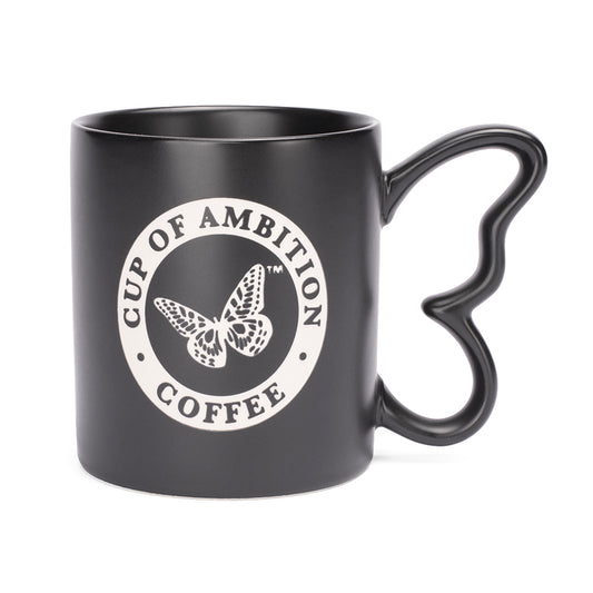 Black ceramic coffee mug featuring a laser-etched design and a unique butterfly-shaped handle, shown from the front view.
