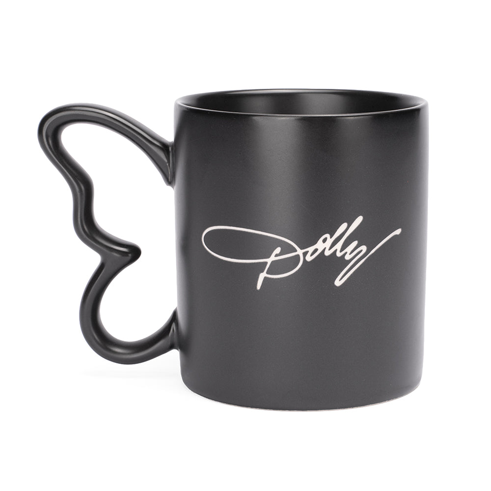 Side profile of the black Dolly Parton mug highlighting the sculpted butterfly handle and smooth matte finish.