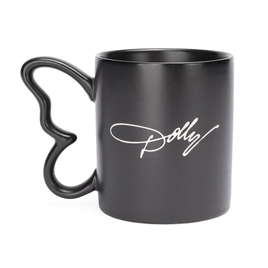 Side profile of the black Dolly Parton mug highlighting the sculpted butterfly handle and smooth matte finish.