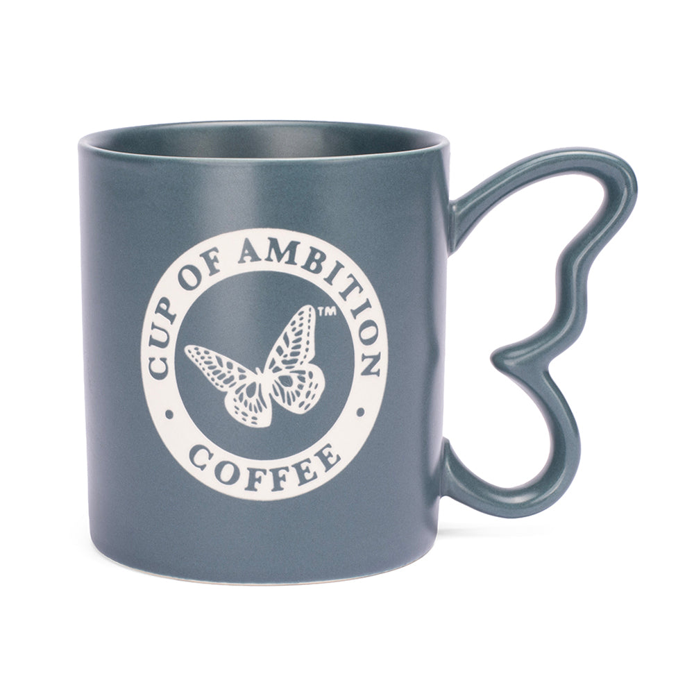 Dolly Parton ceramic mug in denim finish with a sculptural butterfly handle, front view