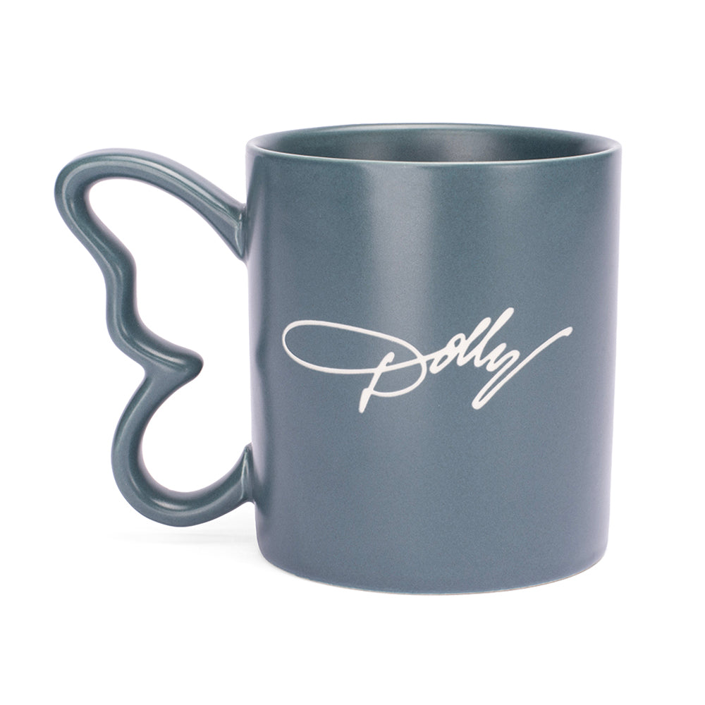 Side profile of the Dolly Parton denim butterfly mug showing the detailed handle and laser etching