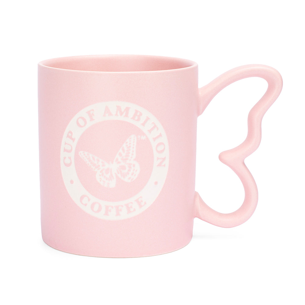 Pink ceramic mug with a sculpted butterfly handle and Cup of Ambition graphic on the front