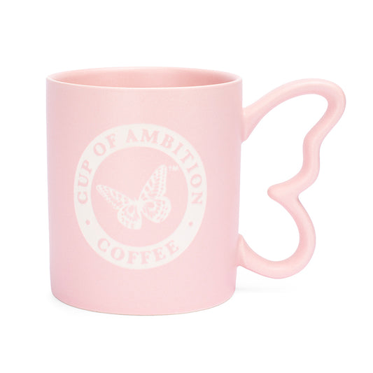 Pink ceramic mug with a sculpted butterfly handle and Cup of Ambition graphic on the front