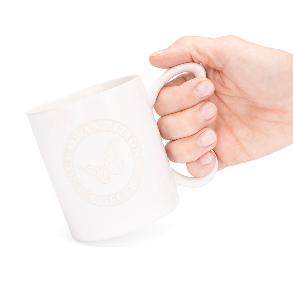 Side view of the laser-etched white mug showing the clean finish and silhouette