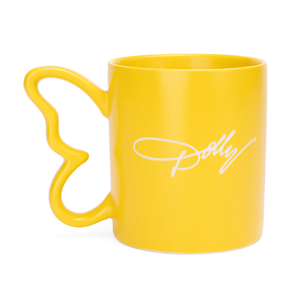 Side view of the yellow Dolly Parton mug highlighting the contoured butterfly handle shape