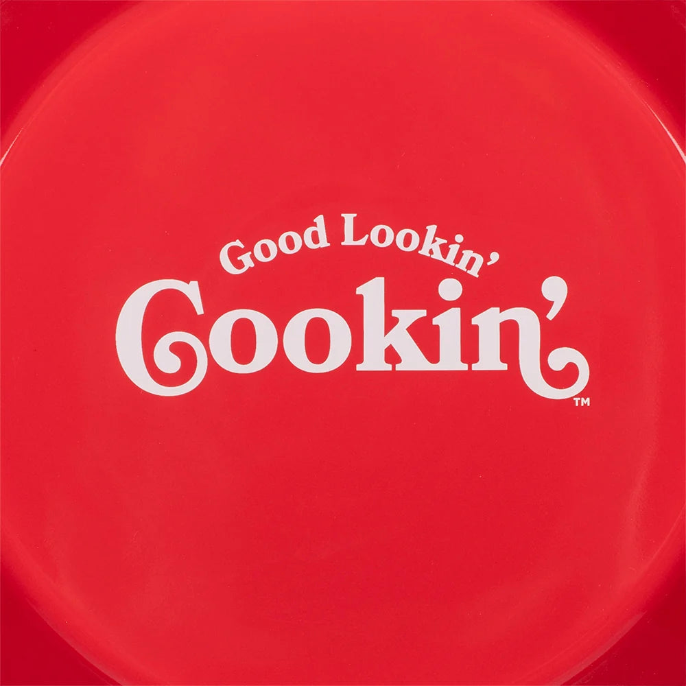 Side profile view of the ceramic pie dish displaying its rounded handles and cream-colored exterior finish