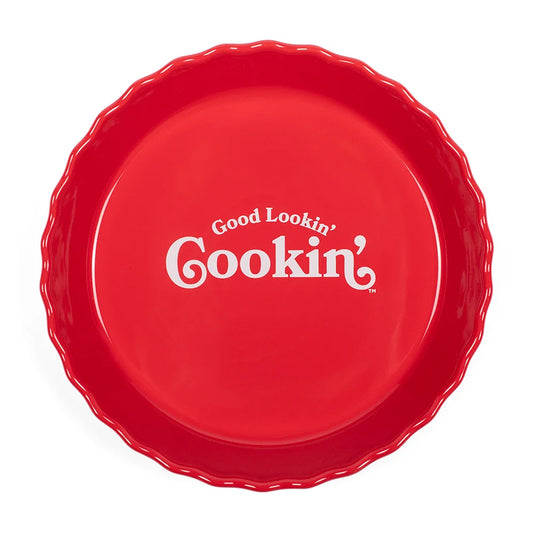 Dolly Parton ceramic pie dish featuring the Good Lookin Cookin title in vintage-inspired lettering on the off-white interior bottom