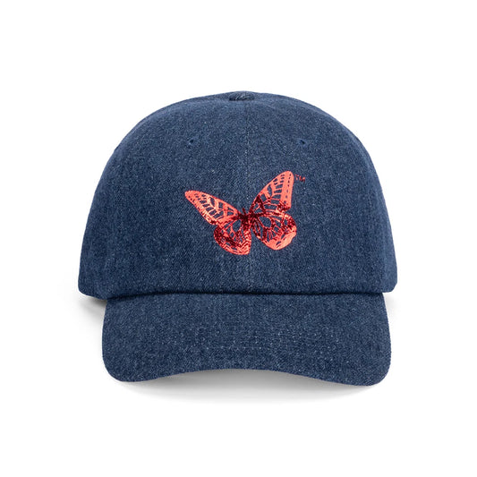 Front view of the Dolly Parton denim baseball cap featuring a shimmering foil butterfly graphic centered on the crown.