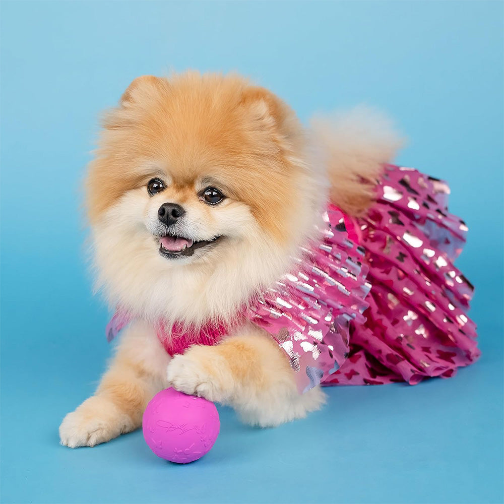 Official Dolly Parton Merchandise. Pink natural rubber ball featuring Dolly Parton's iconic butterfly logo.