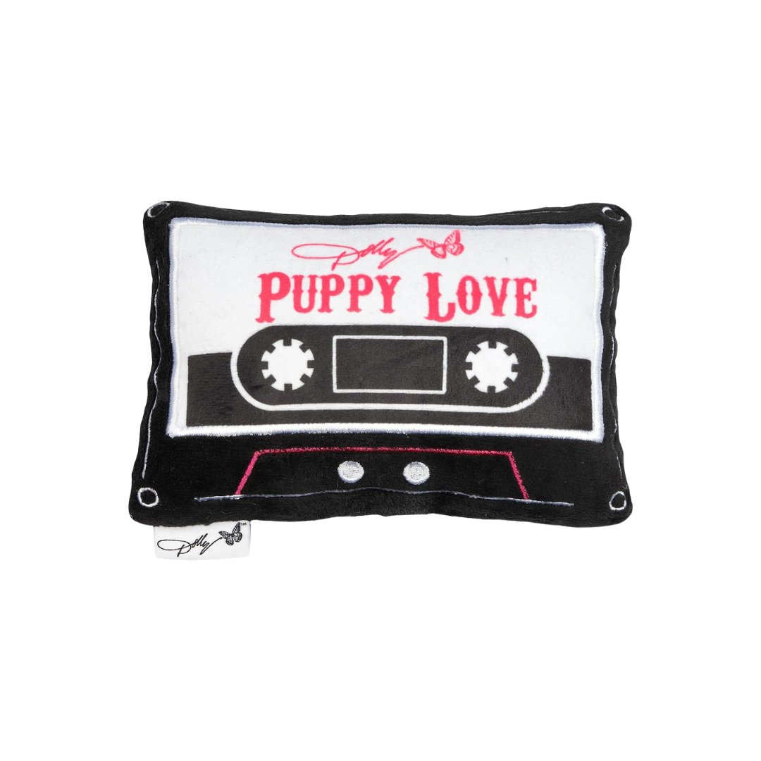 Close-up of Doggy Parton Puppy Love Tape Plush Toy pillow with a cassette design