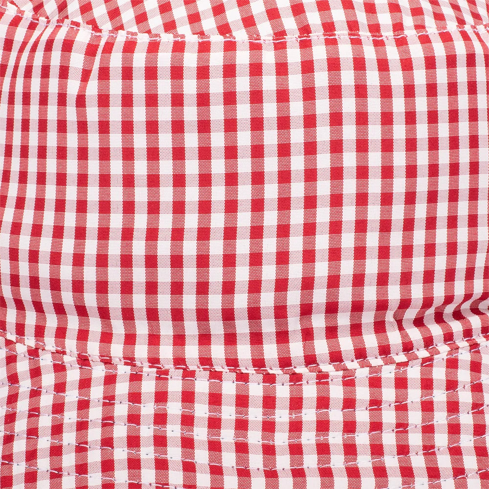 Folded view of the Dolly Parton denim bucket hat resting on a neutral surface