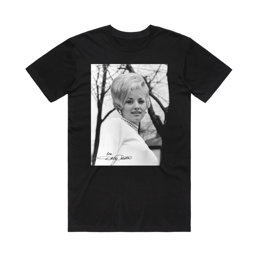 Official Dolly Parton Merchandise. 100% black premium cotton unisex t-shirt with a black and white photo of a young Dolly Parton with 60's style hair and the words "Love Dolly" on the bottom corner of the photo.