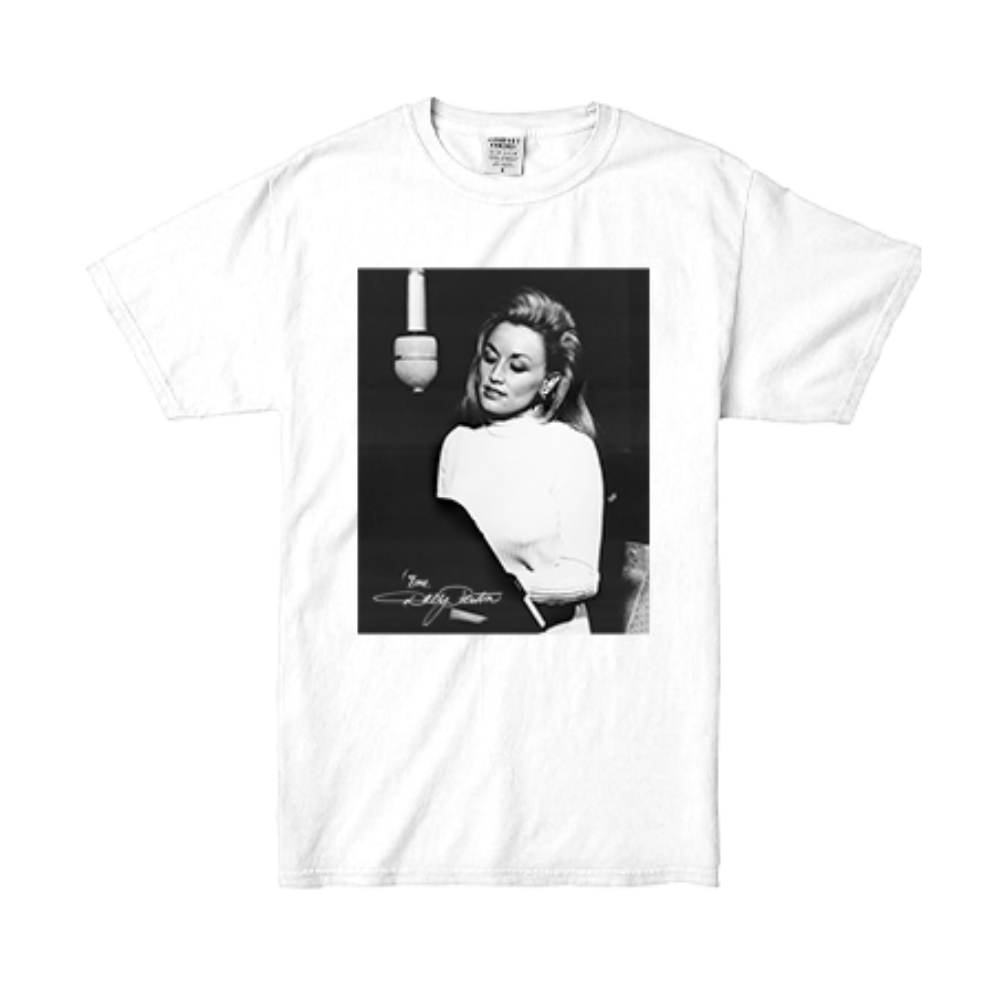 Official Dolly Parton Merchandise. 100% premium white cotton t-shirt with a black and white photo of young Dolly singing in a recording studio setting.