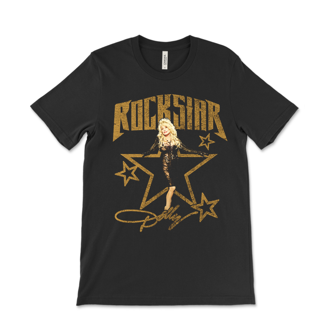 Official Dolly Parton Merchandise. 100% black cotton t-shirt featuring a photo of Dolly and a gold Rockstar album logo.