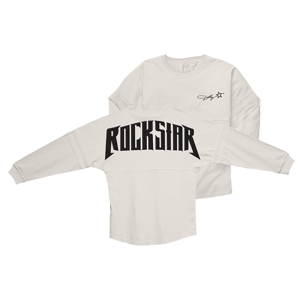 Official Dolly Parton Merchandise. 100% cotton, white unisex game day jersey style long sleeve t-shirt with a wider fit and a round bottom waist. Features the Dolly Rockstar era star logo printed on the front left chest and a black puff print Rockstar album logo printed across the back.