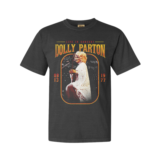 Load image into Gallery viewer, Official Dolly Parton Merchandise. Premium 100% grey cotton unisex t-shirt with a vintage 70&amp;#39;s live photo of Dolly Parton playing guitar in white crocheted dress.
