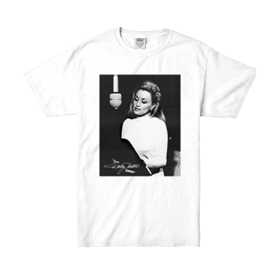 Official Dolly Parton Merchandise. 100% premium white cotton t-shirt with a black and white photo of young Dolly singing in a recording studio setting.